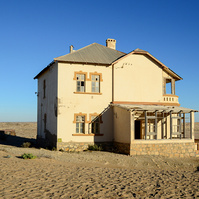 "Portraits of Time" Fine Art Photography Collection. Kolmanskop, Namibia. A work from the collection created at Kolmanskop by photographer, Lizane Louw. An image of an abandoned building in the diamond mining village in the Namib.