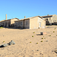 "Portraits of Time" Fine Art Photography Collection. Kolmanskop, Namibia. A work from the collection created at Kolmanskop by photographer, Lizane Louw. An image of an abandoned building in the diamond mining village in the Namib.