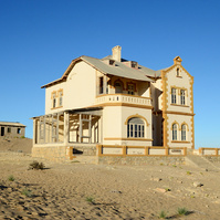 "Portraits of Time" Fine Art Photography Collection. Kolmanskop, Namibia. A work from the collection created at Kolmanskop by photographer, Lizane Louw. An image of an abandoned building in the diamond mining village in the Namib.