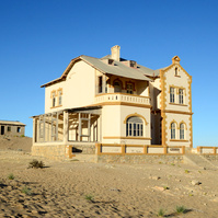 "Portraits of Time" Fine Art Photography Collection. Kolmanskop, Namibia. A work from the collection created at Kolmanskop by photographer, Lizane Louw. An image of an abandoned building in the diamond mining village in the Namib.