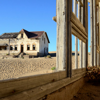 "Portraits of Time" Fine Art Photography Collection. Kolmanskop, Namibia. A work from the collection created at Kolmanskop by photographer, Lizane Louw. An image of an abandoned building in the diamond mining village in the Namib.