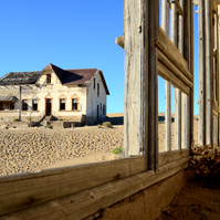 "Portraits of Time" Fine Art Photography Collection. Kolmanskop, Namibia. A work from the collection created at Kolmanskop by photographer, Lizane Louw. An image of an abandoned building in the diamond mining village in the Namib.