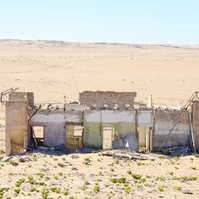 "Portraits of Time" Fine Art Photography Collection. Kolmanskop, Namibia. A work from the collection created at Kolmanskop by photographer, Lizane Louw. An image of an abandoned building in the diamond mining village in the Namib.