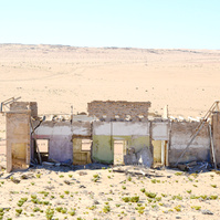 "Portraits of Time" Fine Art Photography Collection. Kolmanskop, Namibia. A work from the collection created at Kolmanskop by photographer, Lizane Louw. An image of an abandoned building in the diamond mining village in the Namib.