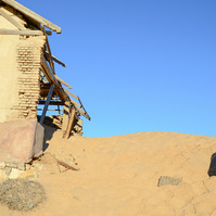 "Portraits of Time" Fine Art Photography Collection. Kolmanskop, Namibia. A work from the collection created at Kolmanskop by photographer, Lizane Louw. An image of an abandoned building in the diamond mining village in the Namib.