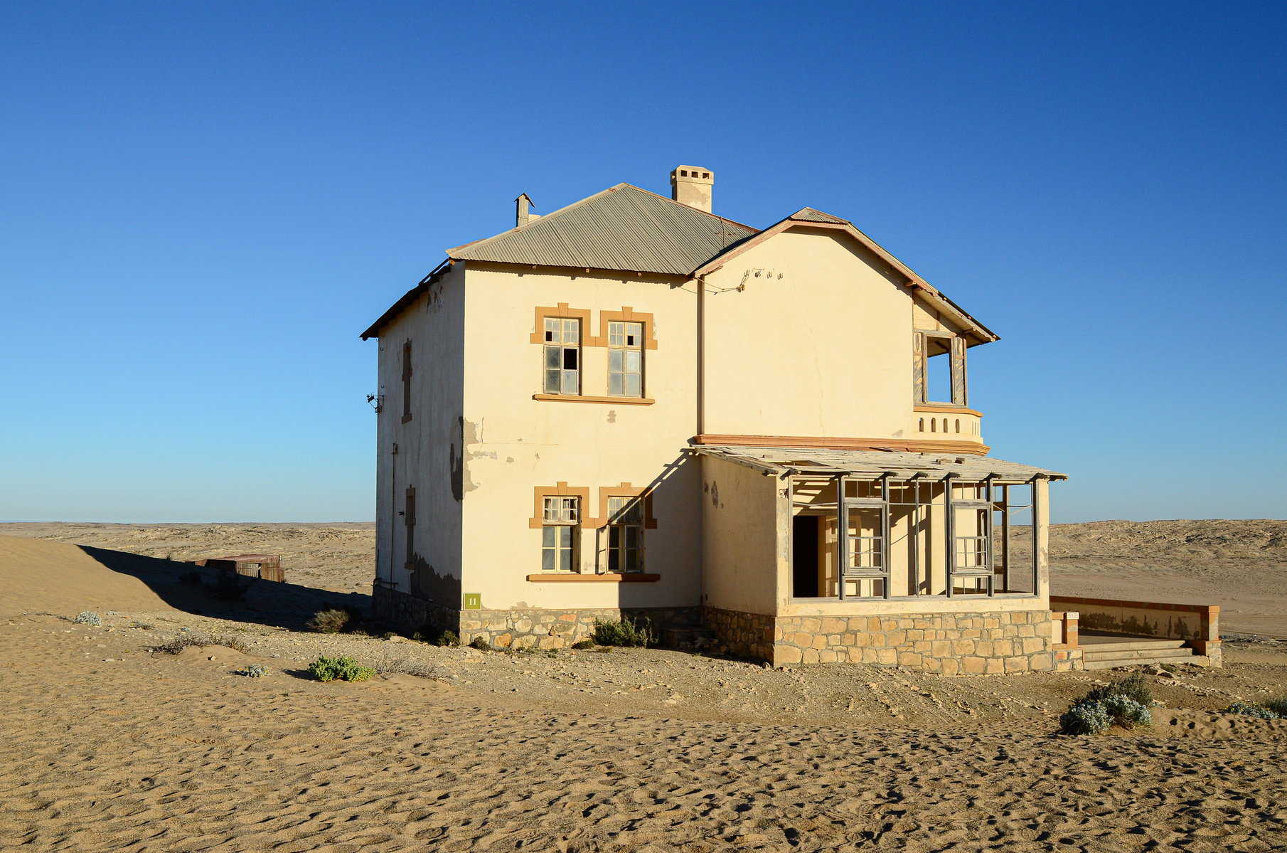 "Portraits of Time" Fine Art Photography Collection. Kolmanskop, Namibia. A work from the collection created at Kolmanskop by photographer, Lizane Louw. An image of an abandoned building in the diamond mining village in the Namib.