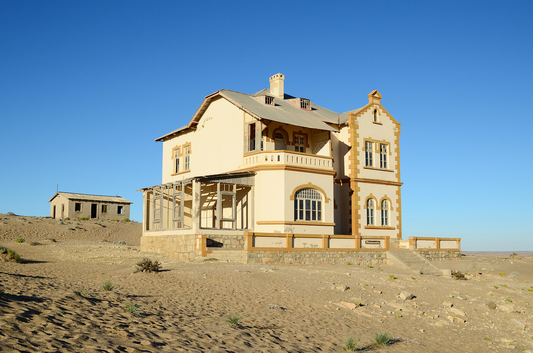 "Portraits of Time" Fine Art Photography Collection. Kolmanskop, Namibia. A work from the collection created at Kolmanskop by photographer, Lizane Louw. An image of an abandoned building in the diamond mining village in the Namib.