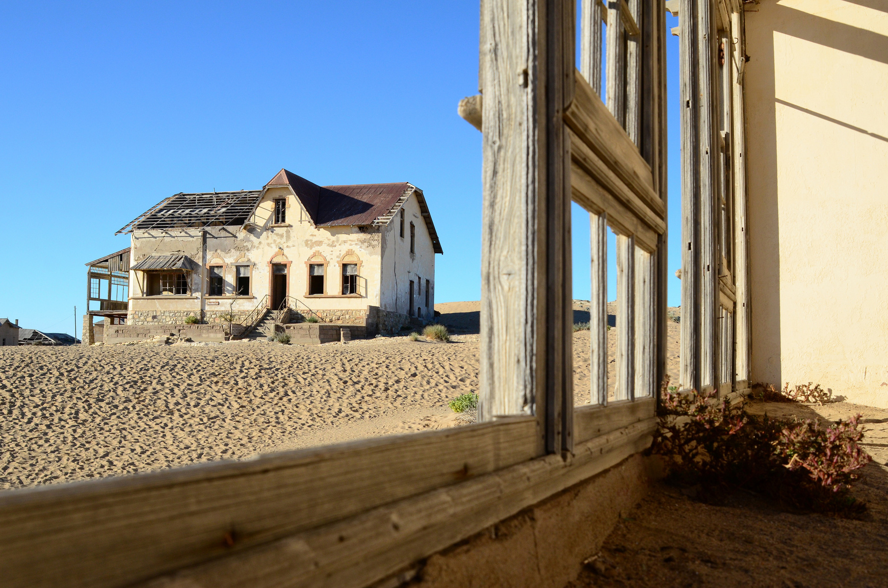 "Portraits of Time" Fine Art Photography Collection. Kolmanskop, Namibia. A work from the collection created at Kolmanskop by photographer, Lizane Louw. An image of an abandoned building in the diamond mining village in the Namib.