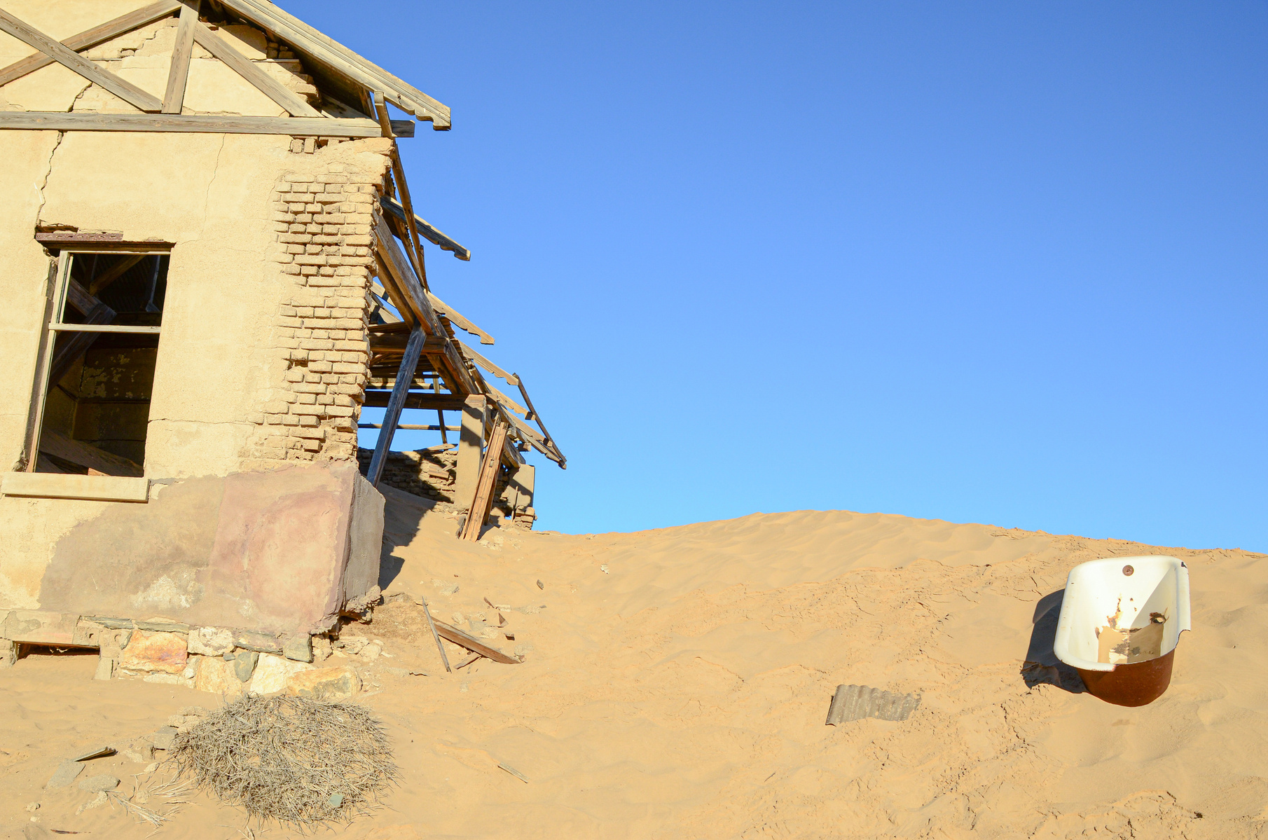 "Portraits of Time" Fine Art Photography Collection. Kolmanskop, Namibia. A work from the collection created at Kolmanskop by photographer, Lizane Louw. An image of an abandoned building in the diamond mining village in the Namib.