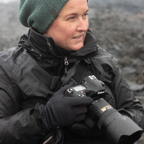 Environmental portrait- Photographer and journalist Lizane Louw. Photographer with a camera. Iceland.