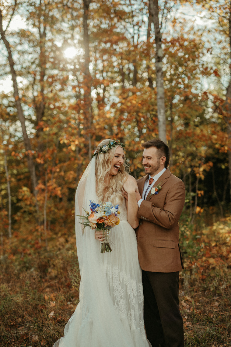 Minnesota couple laughing on Fall wedding day 