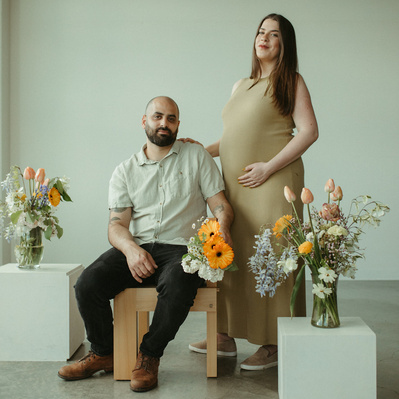 A styled maternity session with floral arrangements in Minneapolis MN.