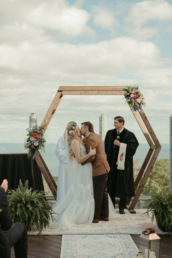 Couple kissing at the alter on wedding day in Minnesota