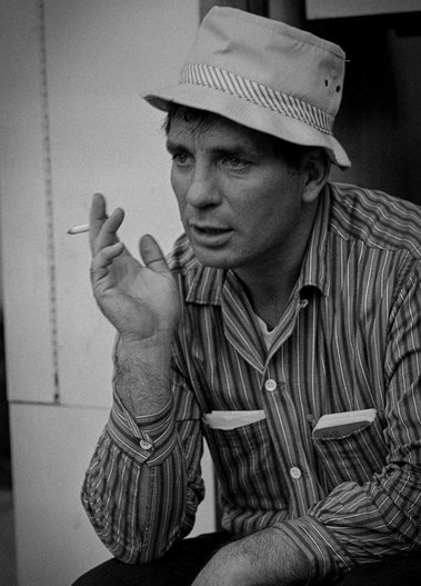 Poet Jack Kerouac, striped shirt white hat holding a cigarette, San Francisco 1963