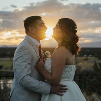 Bride and groom kissing at sunset Brasada Ranch wedding