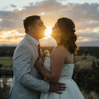 Bride and groom kissing at sunset Brasada Ranch wedding