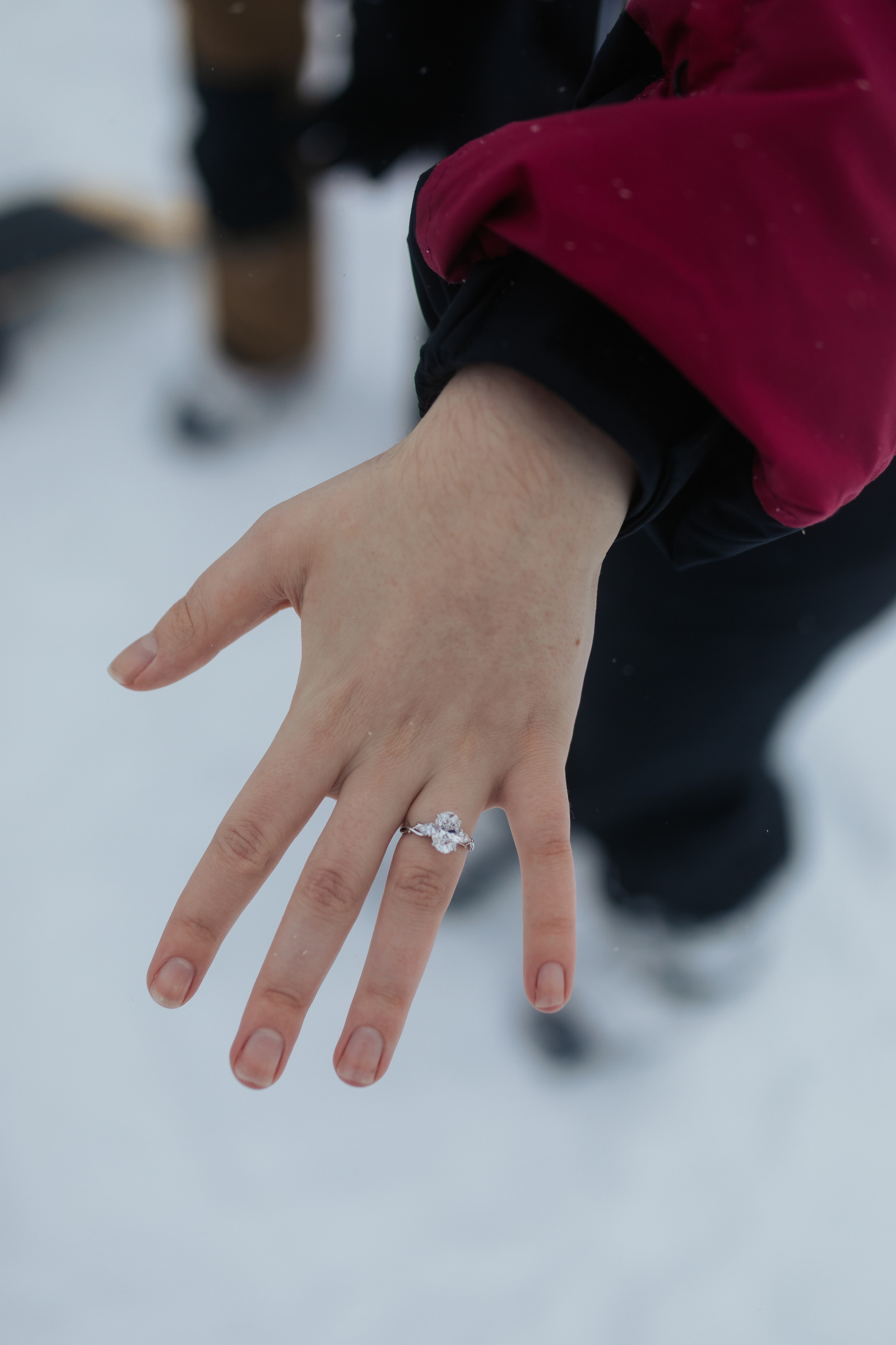 Photo of engagement ring during ski engagement photo session