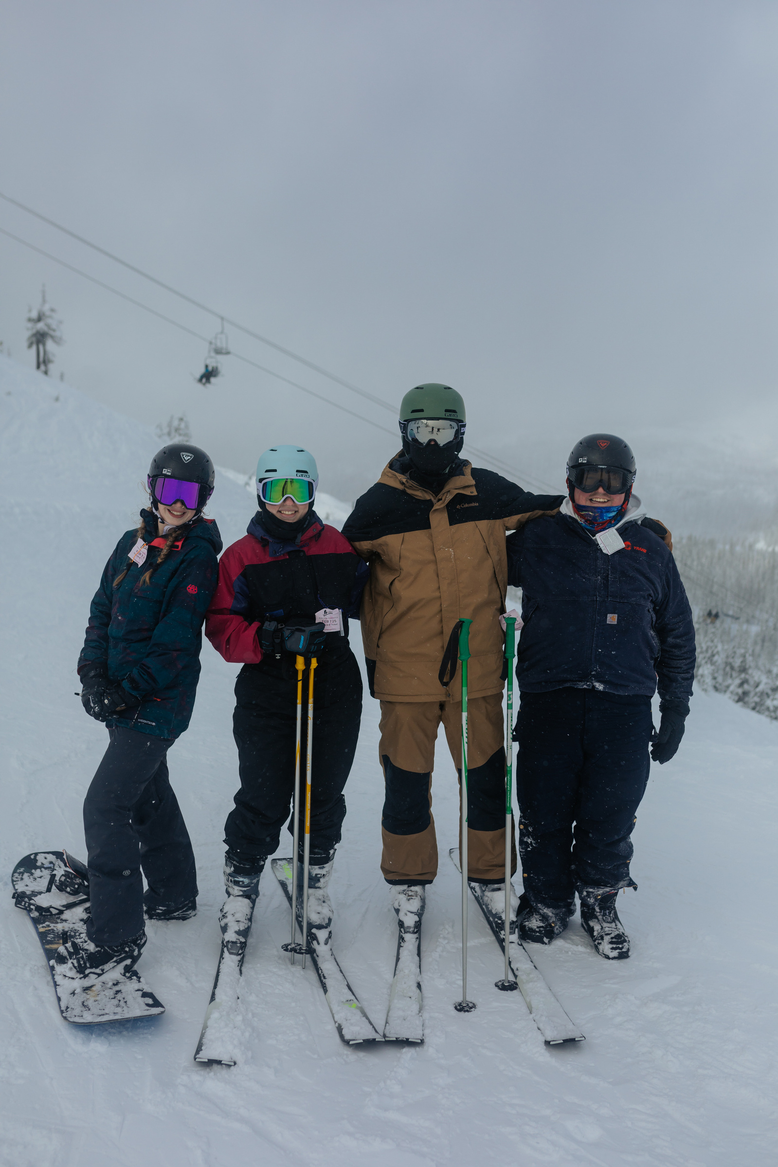 Group photo of friends skiing and snowboarding at Hoodoo Ski Resort in Central Oregon