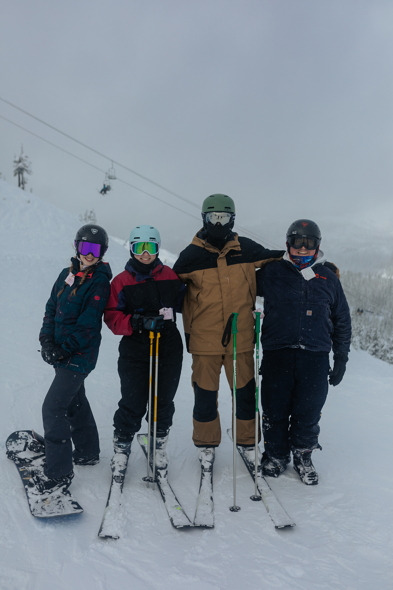 Group photo of friends skiing and snowboarding at Hoodoo Ski Resort in Central Oregon