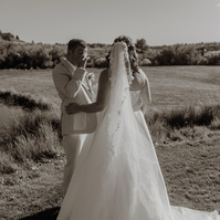 photo of groom crying during first look at Brasada Ranch Trestle Pond in Bend 