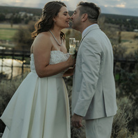 Bride and groom kissing during sunset at Brasada Ranch wedding