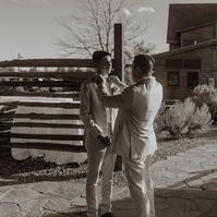 Groom tying his sons tie at Brasada Ranch wedding