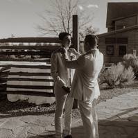 Groom tying his sons tie at Brasada Ranch wedding