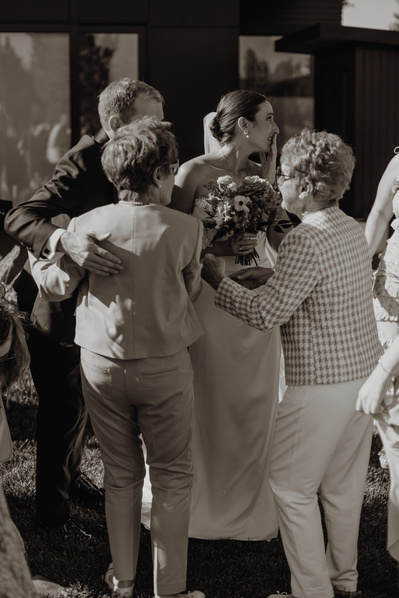 Candid photo of the couple and their grandparents.