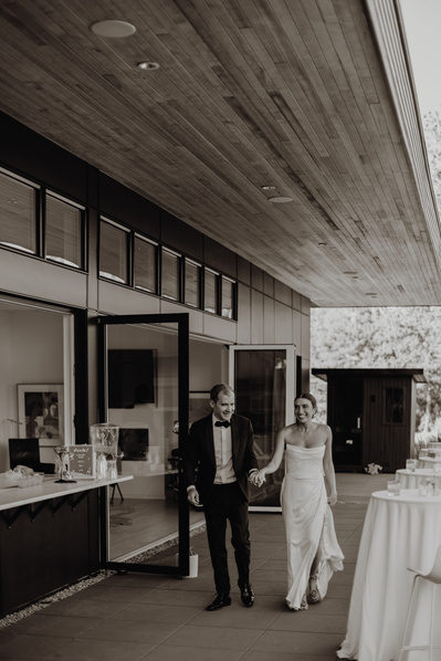 Bride and groom enter their reception