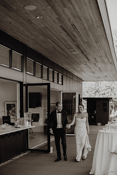 Bride and groom enter their reception