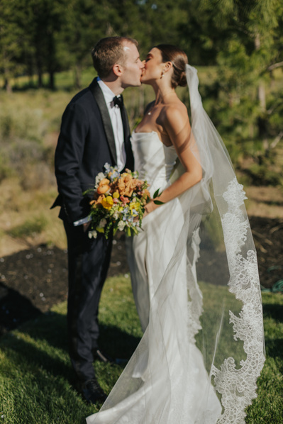 Portrait of couple kissing during their wedding in Bend Oregon