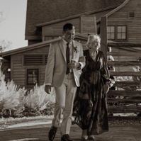 Groom and his mom walking down the aisle at his Brasada Ranch wedding