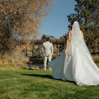 bride walking up to her groom for her first look at the Brasada Ranch Trestle Pond in Bend Oregon