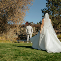 bride walking up to her groom for her first look at the Brasada Ranch Trestle Pond in Bend Oregon