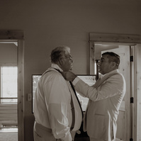 Groom tying his fathers tie during Bend Oregon wedding