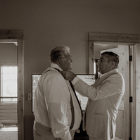 Groom tying his fathers tie during Bend Oregon wedding