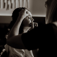 photo of bride getting makeup done at Brasada Ranch at her wedding in Bend Oregon