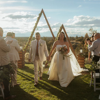 Couple exiting Brasada Ranch wedding ceremony 