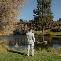 Photo of groom waiting for his first look at the Trestle Pond at Brasada Ranch
