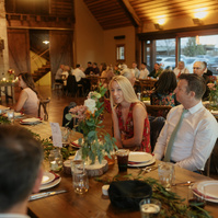 candid photo of guests eating at Brasada Ranch wedding reception in Oregon