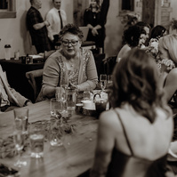 candid photo of guests talking at Brasada Ranch wedding in Bend Oregon
