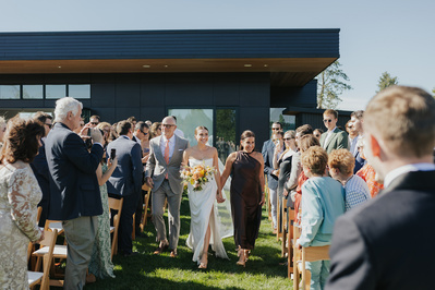 Bride walks down the aisle during her wedding ceremony