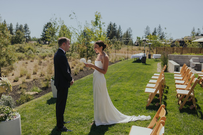 Couple reads vows during backyard wedding