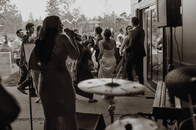 Live band playing during a backyard wedding reception
