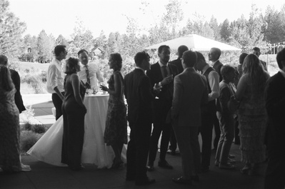 Candid of guests talking at a wedding in Oregon