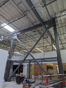 Steel-braced frames were incorporated into the existing building to provide for seismic resistance.