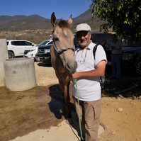 Laurent at a rodeo in a nearby village