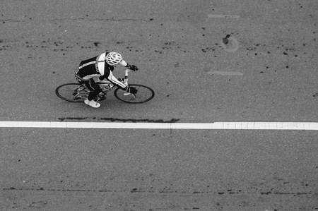 Aerial image in black and white of someone on a bike in uptown Charlotte, North Carolina taken by Matt Chandler with a Nikon DSLR camera