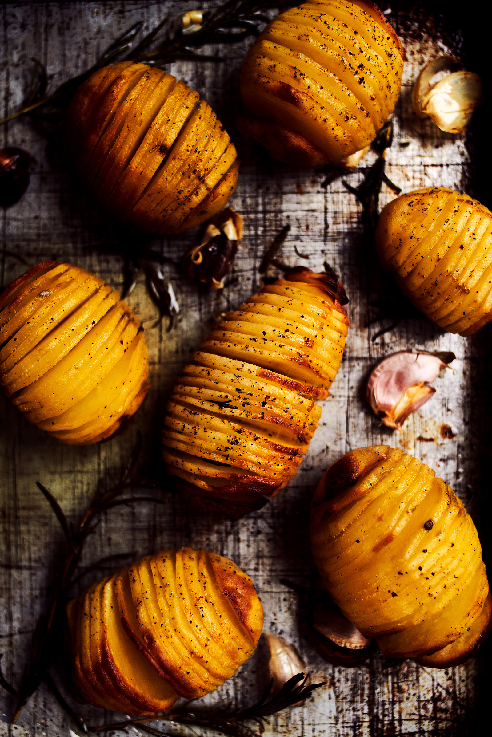Hasselback potatoes on a roasting tray