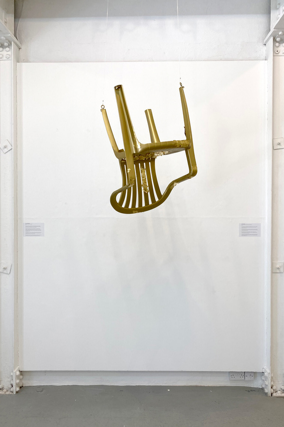 Golden Plastic Garden Chair Sculpture Referencing The Cost Of Queen Elizabath II's Funeral And Coronation Of King Charles III Whilst A Fifth Of The Country Live In Poverty.